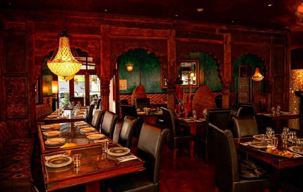 Ornate Indian dining room with carved timber decor